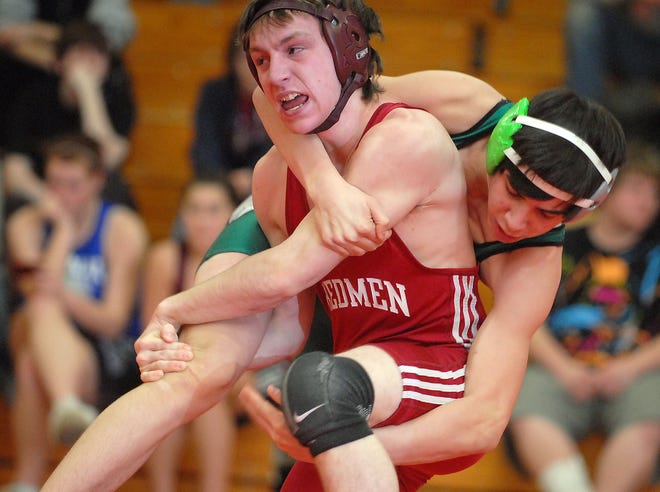 Killingly's Mike Farquharson, front, breaks out of a hold from Griswold's Cody Daley in a 125-pound match at Killingly High School Wednesday, January 27, 2010. Farquharson won the match.