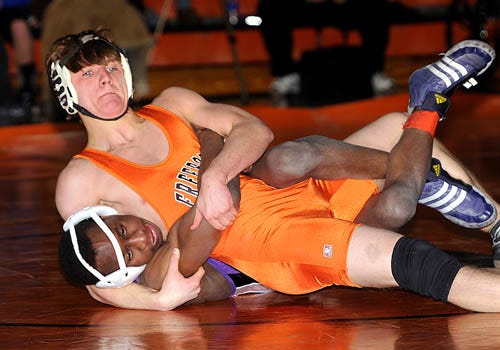 Freeport's Dave Genkinger works to pin his opponent Tuesday in Freeport.