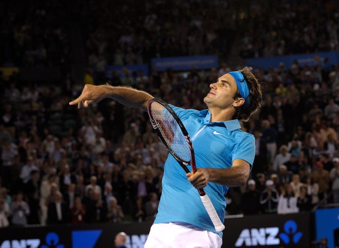 Federer throws his wristband to the spectators after easily knocking off Jo-Wilfried Tsonga in the semifinals Friday night.