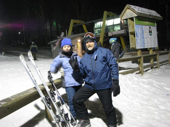MAGGIE FITZROY/StaffRoger Staggs, with wife, Teresa, hit the slopes in North Carolina on Tuesday evening.