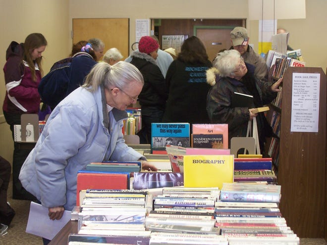 Donna Stahl, of Greece, browses for books at the Friends of the Gates Public Library winter book sale.