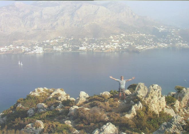 Mark Bradley celebrates a mountain climb on the Greek island of Telendos, Kalymnos