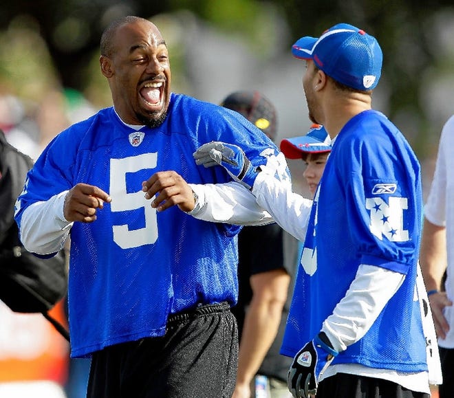 Philadelphia quarterback Donovan McNabb (5) and Chicago's Johnny Knox have some fun during practice for the Pro Bowl on Saturday morning in Fort Lauderdale, Fla.