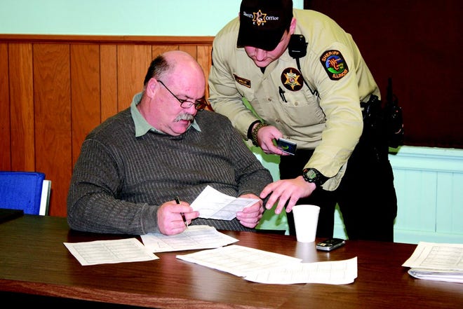 Sheriff Martin Edwards adds vote results Tuesday night at the Warren County Courthouse. He defeated P.J. Brooks 70 percent to 30 percent.