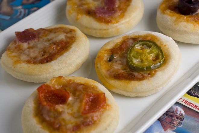 Bite-size pizza sliders are perfect for a Super Bowl gathering. Prepared in advance, they can be quickly baked in a hot oven as they are needed.