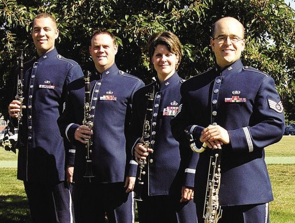 The Bay State Winds, an ensemble of the U.S. Air Force Band of Liberty, will perform a free concert at Grace Episcopal Church in New Bedford Sunday afternoon. Pictured here are SrA Ian Tyson, TSgt Richard LaCroix, MSgt Jennifer Dashaw and SSgt Mickey Ireland, tour manager. For this concert, SSgt Michele Von Haugg will replace SrA Tyson. SSgt Ireland assures concertgoers that they will be home in plenty of time for the Super Bowl kickoff.
