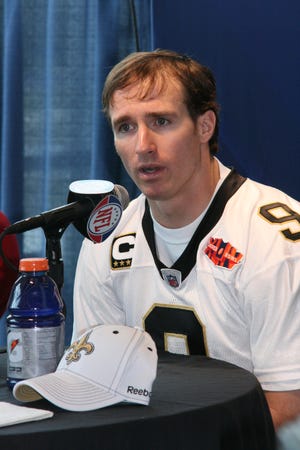 New Orleans Saints quarterback Drew Brees answers a question during Tuesday's media day at Sun Life Stadium in Miami.