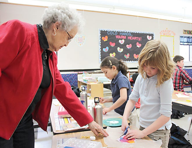 Students at Ss. Peter and Paul Catholic Church have been celebrating Catholic School Week with special events and activities. Mary Louise Helwig is helping her granddaughter in the first grade, Eleanor Wentworth, make Valentine’s Day cards for the veterans hospital in Grand Rapids. SSPP also had a food fundraiser called Hoops for Hunger, which will go to Zion Community Food Pantry.