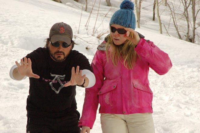 Adam Green directs actress Emma Bell during filming of the movie "Frozen." Green, a Holliston native, wrote and directed the film, which opens today.