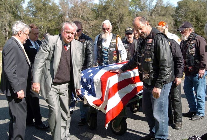 Members of the U.S. Military Veterans Motorcycle Club lead the casket of George Lieninger, a homeless Vietnam veteran, during a funeral service at Forest Lawn Funeral Home on Thursday, Feb. 4, 2010. The Homeless Veterans Burial Program is handled by volunteers with the Marion County Veterans Council and Dignity Memorial.