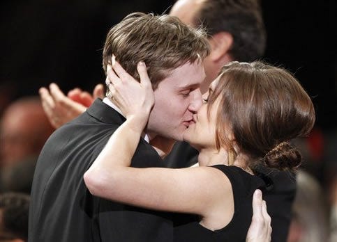 Aaron Stanton from the cast of "Mad Men" kisses his wife, Connie Fletcher after his show won the award for ensemble in a drama series at the 16th Annual Screen Actors Guild Awards on Saturday, Jan. 23, 2010, in Los Angeles. (AP Photo/Mark J. Terrill)