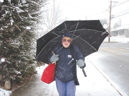 Nancy Funk of Myrtle Avenue braves the snow Friday afternoon while walking along East Second Street near Waynesboro Area Senior High School on her way to the Waynesboro YMCA. The snow started at 11:40 Friday morning and by this morning, between 8 and 10 inches had accumulated in Waynesboro.