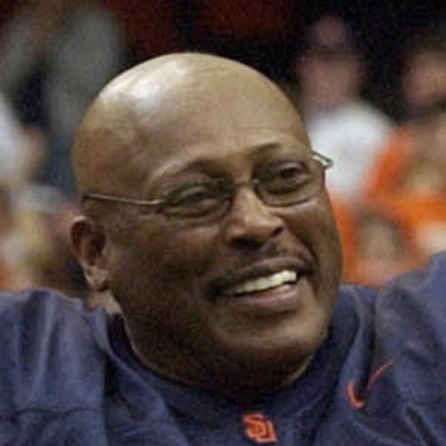 Former Syracuse and Denver Broncos running back Floyd Little acknowledges the crowd during a halftime ceremony to retire his No. 44 jersey in Syracuse, N.Y., on Nov. 12, 2005.