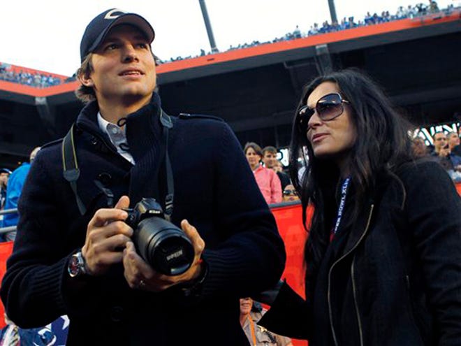 Actor Ashton Kutcher and wife, actress Demi Moore are seen on the sidelines before the NFL Super Bowl XLIV football game between the Indianapolis Colts and New Orleans Saints in Miami.