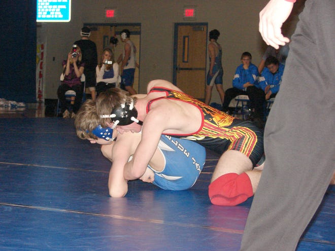 Devils Lake’s Brandon Ramsey works to control Jamestown’s Reese Waldie during their 160-pound match at last Friday’s dual at Jamestown. Ramsey pinned Waldie in 3:21, but the Blue Jays won the dual 54-22.