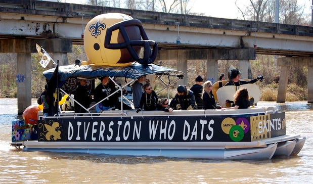 A boat was decked out in a New Orleans Saints theme in the 7th Annual Krewe of St. Amant Mardi Gras Parade Saturday. The boat parade is held each year on the Diversion Canal as a fundraiser for the Dreams Come True charity.