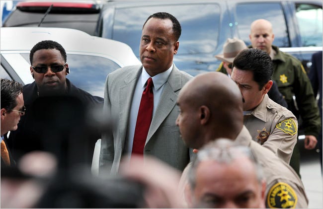 Dr. Conrad Murray, Michael Jackson’s physician, being lead into the Los Angeles Airport Branch Courthouse for arraignment on Monday.