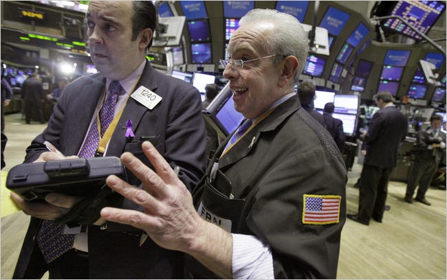 Robert Maher, left, and Anthony Alvarino on the floor of the New York Stock Exchange Tuesday.