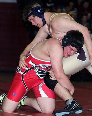 Cameron Hopkins (left) and the Milford wrestling team will take on powerhouse North Attleboro in the state semifinals tonight.