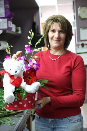 Anita Dinatale of Fabiano Florists arranges flowers.