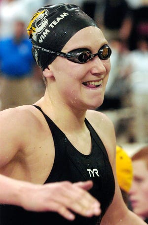 Missouri’s Lauren Lavigna smiles after winning the 200-meter backstroke Sunday at the Missouri Grand Prix at the Mizzou Aquatics Center.