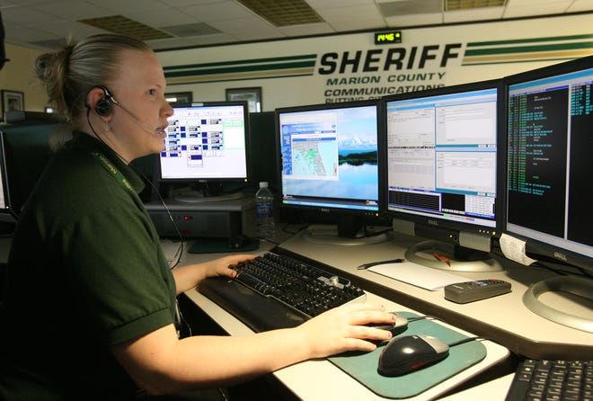 Dispatcher Kristine Meyers works in the communications center at the Marion County Sheriff's Office on Sept. 17, 2009.
