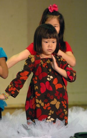JOHN PEMBERTON/The Times-UnionZoey Clontz, 6, practices her dance in preparation for the Chinese New Year.