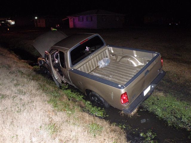 A truck landed in a ditch after colliding head-on with a car in St. Amant.