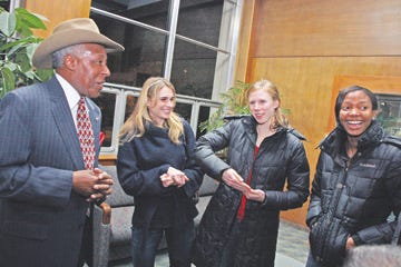oe Clark, the former high school principal featured in the movie ‘Lean on Me,’ left, chats with University of Tennessee students Sarah Bowman, Phoebe Wright and Kimarra McDonald during his visit to Knoxville.