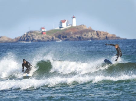 FILE PHOTO
Surfers, shown here in this file photo, together with York fishermen, continue to fight a U.S. Army Corps of Engineers plan to dump dredged sand from the Piscataqua River off Long Sands Beach.