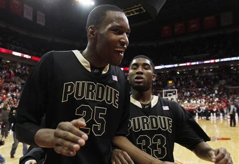 Purdue's JaJuan Johnson (25) and E'Twaun Moore (33) celebrate after a 60-57 win over Ohio State in an NCAA college basketball game Wednesday, Feb 17, 2010, in Columbus, Ohio. (AP Photo/Terry Gilliam)