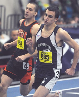 Wilminton junior Marc Shibilia sprints through a turn in the 300 meter run during the Division III State Tournament at the Reggie Lewis Track Center in Boston Sunday.
Staff photo by Orlando Claffey