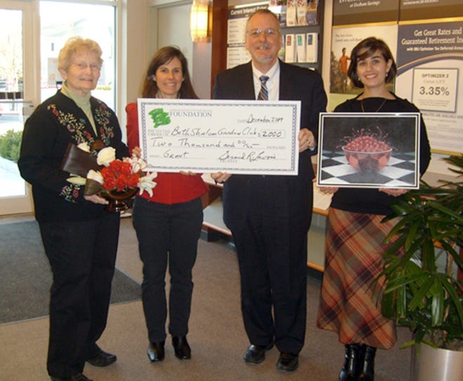 The Dedham Institution for Savings Foundation is supporting the collaborative efforts of the Beth Shalom Garden Club and the Needham High School Fine Arts Department with a grant for Needham’s Art in Bloom 2010. From left to right are Sue Kaplan, Allison Shapiro, co-chairmen of Needham’s second Art in Bloom event, Jerry Lavoie, Trustee, Dedham Institution for Savings Foundation, and Shireen Yadollahpour, faculty coordinator, Needham High School Fine Arts Department.