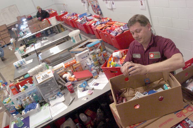 Akron-Canton Regional Foodbank employee John McKenzie provides the initial sort of donated food items. The Foodbank provides food for more than 40,000 people each week in an eight county area.