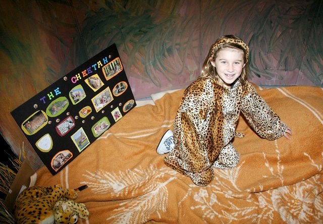 EJ Hersom/Staff photographer 
Emily Lopez, a Saint Mary Academy fourth grader, blends into her environment while dressed as a cheetah.