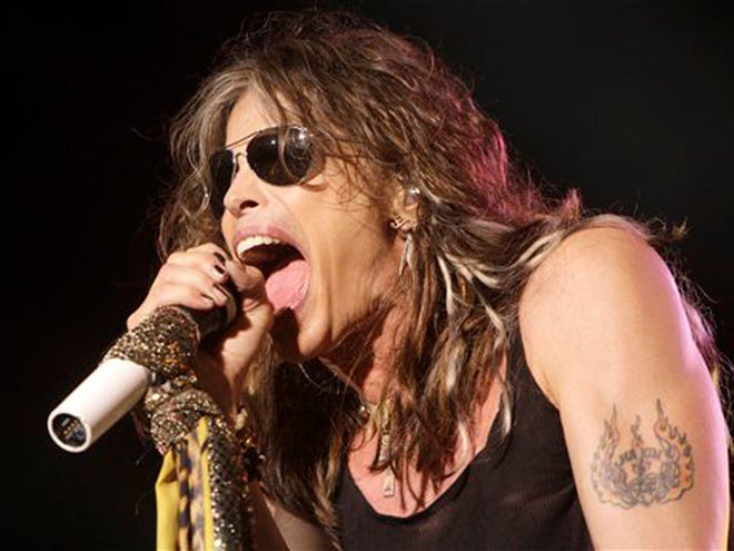In this June 10, 2009 file photo, lead singer Steven Tyler of the rock band Aerosmith performs at the Verizon Wireless Amphitheatre in Maryland Heights, Mo.