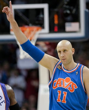 Cleveland Cavaliers center Zydrunas Ilgauskas acknowledges the crowd while entering the game during the first quarter against the Phoenix Suns, Wednesday, Dec. 2, 2009, in Cleveland. Ilgauskas, whose career was nearly ended by severe foot injuries, became the team's career leader with 724 games played.