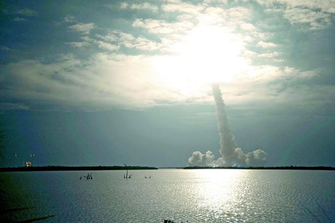 The takeoff of the STS-130 space shuttle.