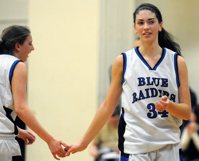 Hopedale's Katherine Englund (right) gets a quick five from Devin Finnegan during the Blue Raiders' game against St. Mary's.