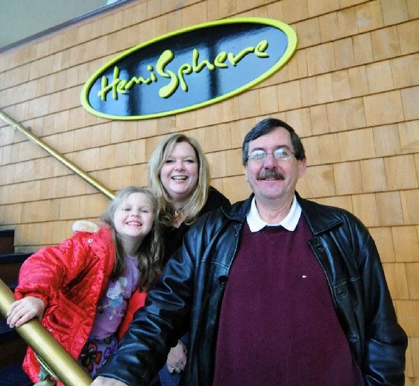 Hemisphere owners Tracy Labonte, center (with her daughter, Sadie), and Paul Sylvia will give $25 restaurant gift certificates to Sandwich town workers, who have not had raises in two years.