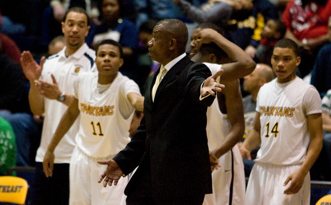Southeast head coach, Lawrence Thomas, looks for a foul call during the second half at Southeast High School in Springfield, Ill., Friday, Feb. 5, 2010.