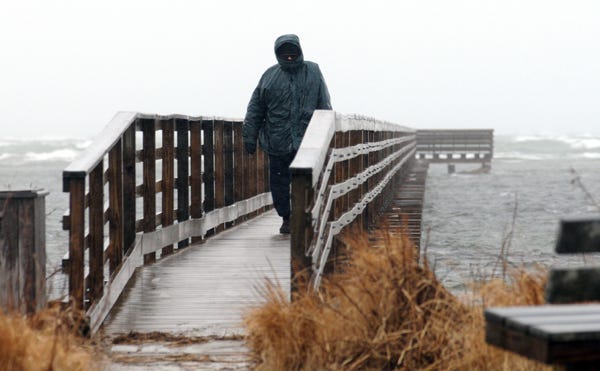 YARMOUTHPORT  -- 03/01/10 -- A walker takes to the boardwalk at Gray's Beach Monday morning. 030110ml