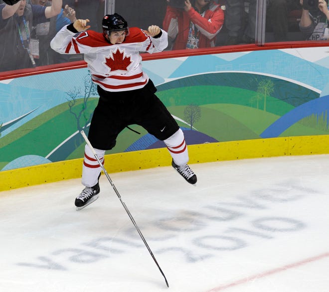 Canada's Sidney Crosby (87) leaps in the air after making the game-winning goal in the overtime period of a men's gold medal ice hockey game against USA at the Vancouver 2010 Olympics in Vancouver, British Columbia, Sunday, Feb. 28, 2010. Canada won 3-2. (AP Photo/Chris O'Meara)