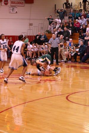 Richwoods sophomore Maggie Cunningham dives for a loose ball Monday night against Hillcrest in the Streator Supersectional. The Lady Knights lost 55-47 and finished the season with a 24-11 record.