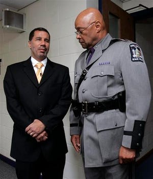 In this file photo taken May 27, 2008, New York Gov. David Paterson, left, talks with New York State Police Superintendent Harry Corbitt talk before Corbitt was sworn in at a ceremony in Albany, N.Y. Corbitt said Tuesday, March 2, 2010, that he was retiring from his position.