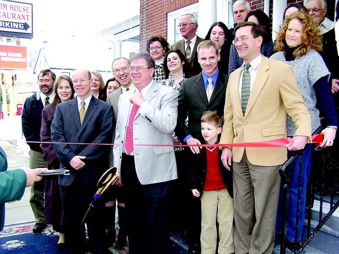 The law firm of Dick, Stein, Schemel, Wine and Frey held a ribbon cutting ceremony after its office relocated in Greencastle. Joined by employees, family and friends are the partners, front row from left: Paul Schemel, J. Edgar Wine, William Dick, James Stein and John Frey. The law firm moved into its new location at 119 E. Baltimore St. in December. The firm is a full service law firm with two offices located in Greencastle, and one located at 13 W. Main St., Suite 210, Waynesboro. The firm provides legal assistance in numerous areas, including estate planning, Medicaid planning, business planning, personal injury litigation, contract litigation, workmen's compensation, bankruptcy, and real estate development and zoning issues. The firm is the largest Franklin County-based law firm and provides services in Maryland and West Virginia as well. The firm is also associated with Premier Property Settlements, Inc which provides all types of real estate settlement services for individuals and companies buying or selling residential and commercial real estate.