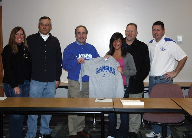 Ionia senior Anna Conrad signed her National Letter of Intent Friday morning to play softball next spring for Lansing Community College. Above, Conrad poses with, from left, stepmother Cindy Conrad, father Gordon Conrad, LCC coach Bob Every, West Coast Fundamentals pitching instructor Rob Dunham and Ionia softball coach Andy Barr.