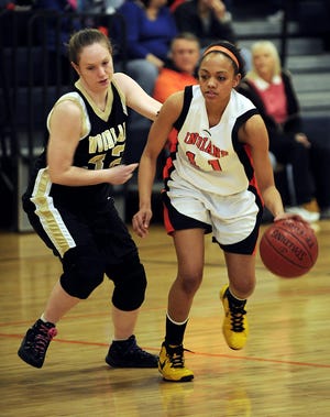 Montville's Stephanie Jones, right, drives on Woodland's Jennifer Federicks, left, Tuesday, March 2, 2010 in the first half of their Class M tournament first-round game in Montville.