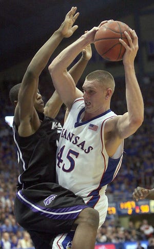 Kansas center Cole Aldrich (45) runs into Kansas State forward Wally Judge (33) during the Jayhawks' 82-65 romp Wednesday night in a much-hyped rematch of the Sunflower Showdown. Aldrich finished with nine points and seven rebounds.