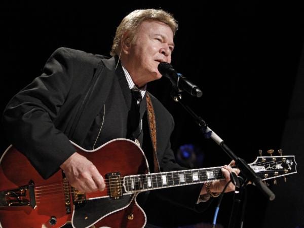 Country music star Roy Clark performs after being inducted into the Country Music Hall of Fame.